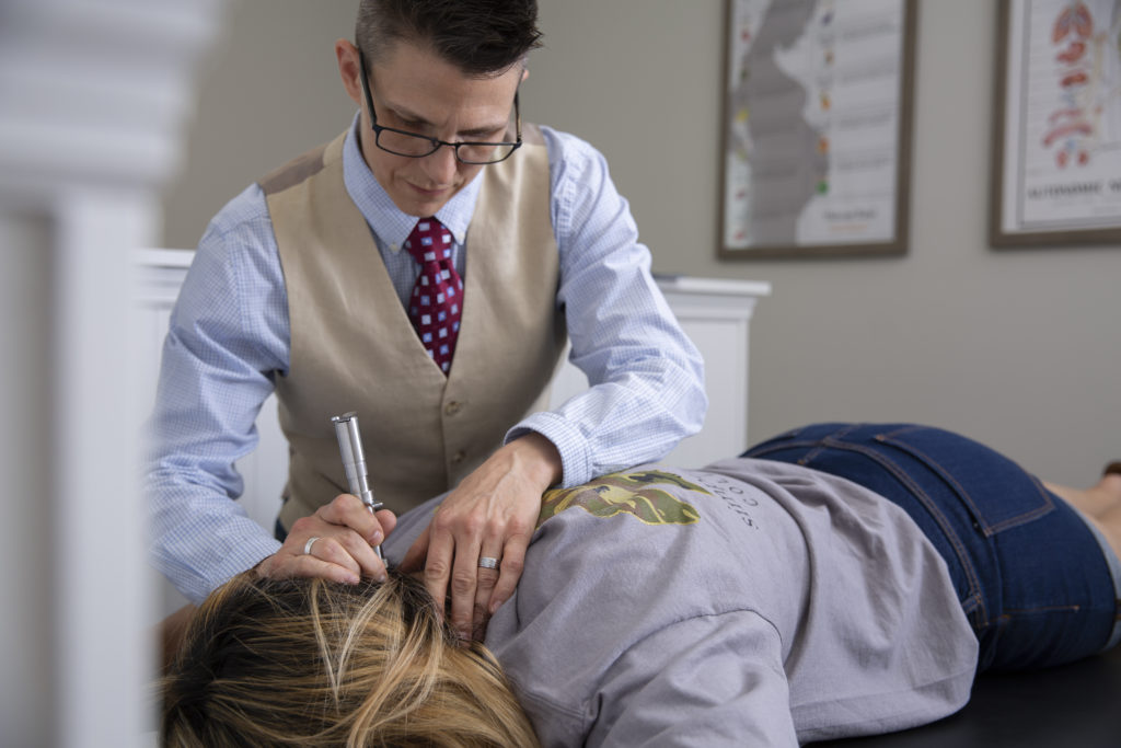 Chiropractic Spine Exam on woman in Rising Chiropractic Evans Georgia Office